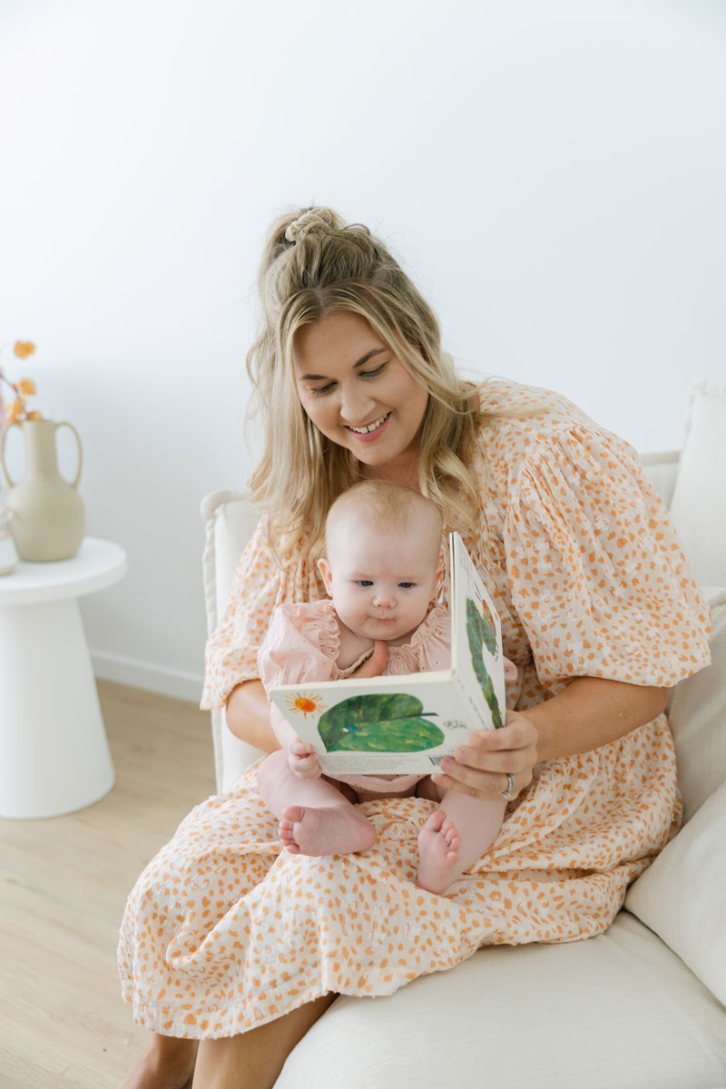 Beck reading to a baby